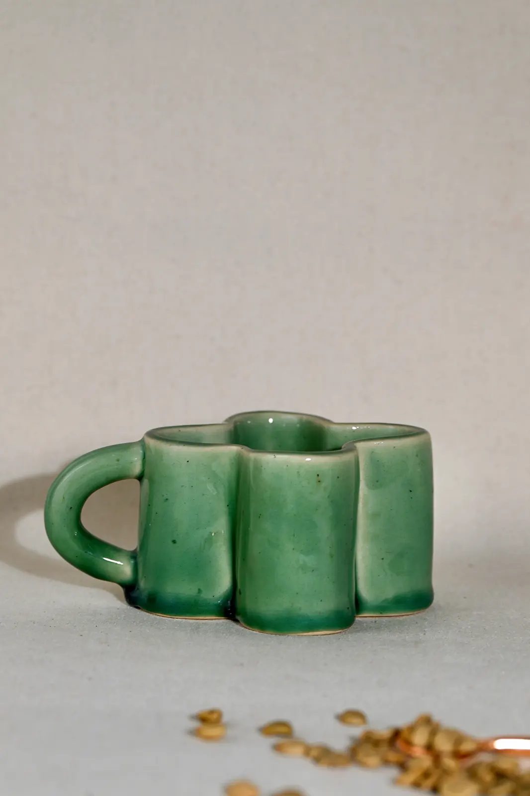 Green ceramic daisy shape cappuccino mug, cappuccino mug, coffee mug, ceramic coffee mugs, sustainable coffee mugs, handmade coffee mugs, coffee mug glass, hand painted coffee mugs, Toh, Sepia stories