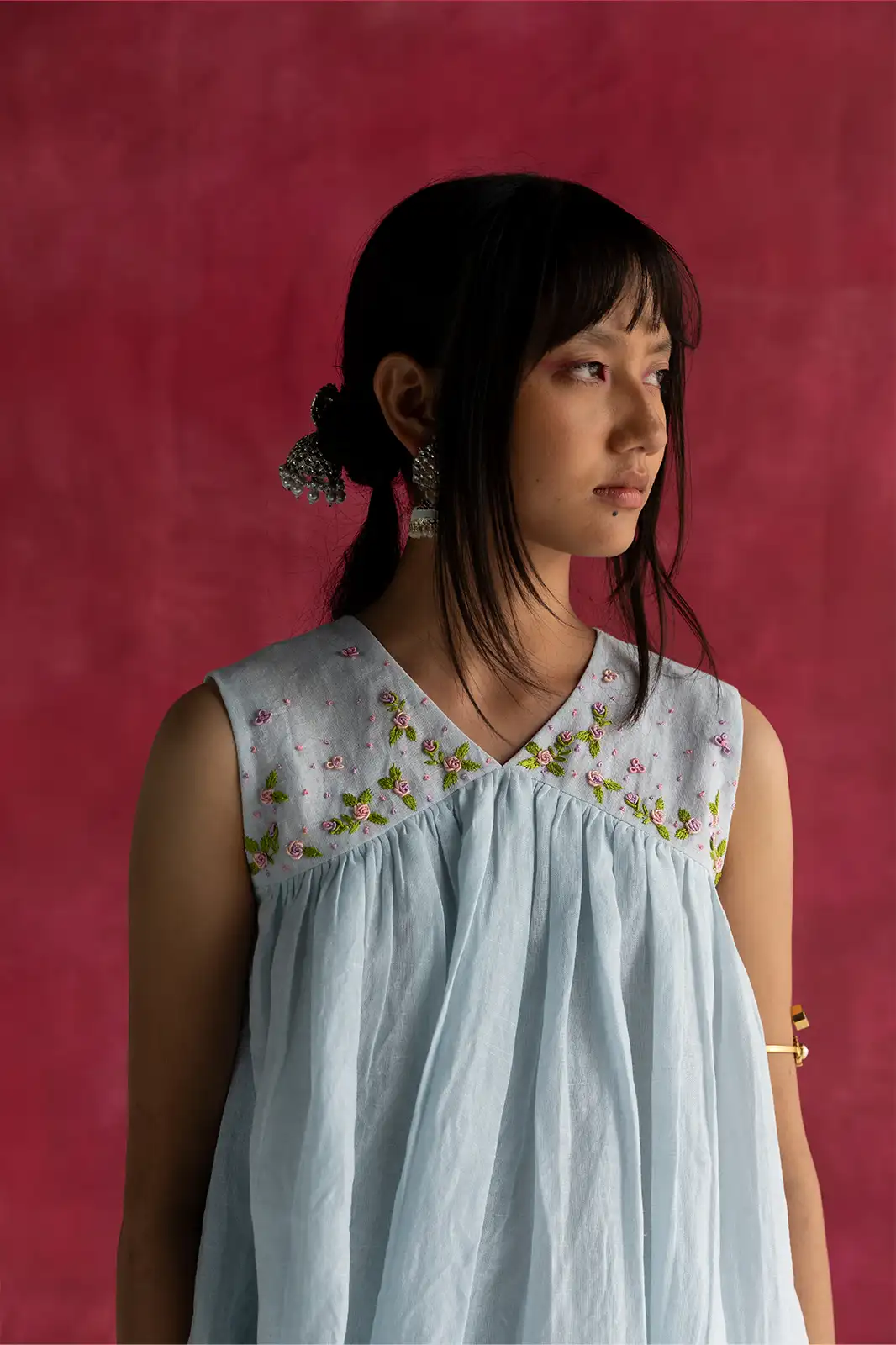 Laugh in Flowers Top, pastel blue linen top, hand embroidered linen top, empire line gathers top, Sepia Stories clothing, pure linen women’s top, sustainable fashion India, designer linen tops, elegant pastel blue blouse, casual linen wear, artisan crafted top