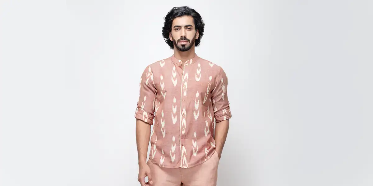 diverse fashion collection, stylish bearded man dark wavy hair pink Ikat shirt pattern hands in pockets, confident dark-haired male side profile brown Ikat shirt rooftop urban skyline outstretched arm, poised woman long dark hair wind-blown brown Ikat shirt earring accent blurred cityscape, colorful Ikat shirts display vibrant red blue green yellow hues traditional woven textile patterns, multicolor Ikat shirts collection red yellow blue green shades variety, minimalist light gray background rooftop outdoor setting, ethnic textile design cultural heritage clothing, modern traditional blend contemporary fashion concept, vibrant pattern contrast dynamic color contrast, artistic textile art creative fabric design, cultural elegance contemporary style illustration, traditional craft focus modern heritage fusion