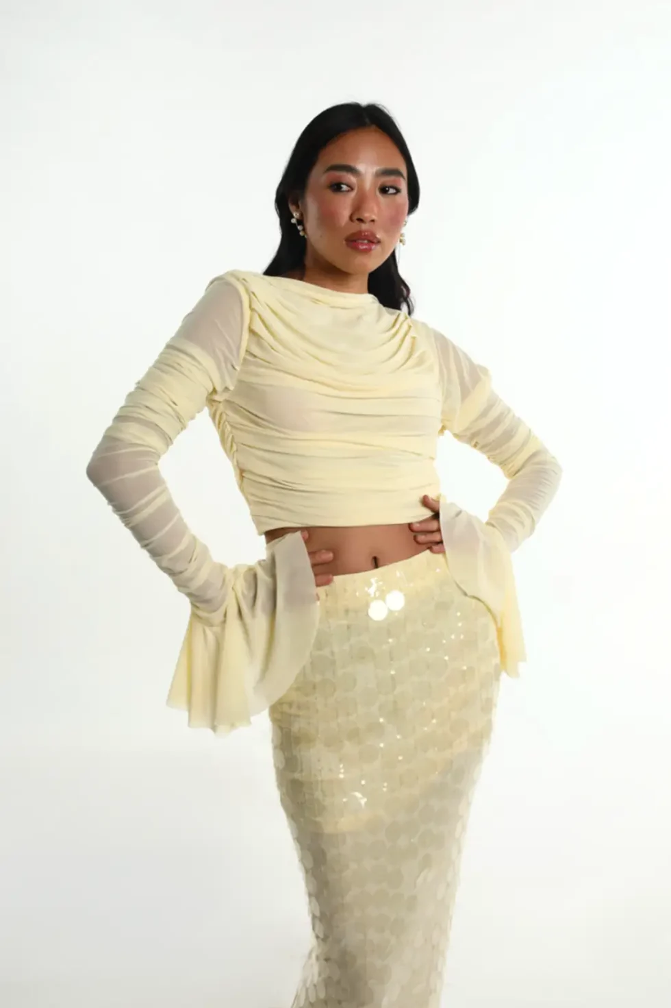 Ondina Yellow Lycra Net Top Skirt, Pastel Yellow Dress, Long Sleeve Top And Skirt Set, High Neck Dress For Women, Party Dress With Sleeves, Party Wear Long Skirts And Tops, Sepia Stories, Party Dress, Casual Long Skirts And Tops, Long Skirts And Tops For Ladies, High Neck Party Wear Dress For Women