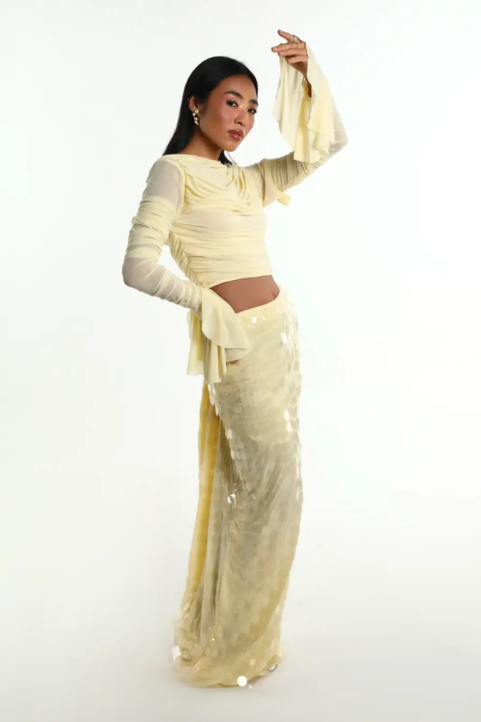 Ondina Yellow Lycra Net Top Skirt, Pastel Yellow Dress, Long Sleeve Top And Skirt Set, High Neck Dress For Women, Party Dress With Sleeves, Party Wear Long Skirts And Tops, Sepia Stories, Party Dress, Casual Long Skirts And Tops, Long Skirts And Tops For Ladies, High Neck Party Wear Dress For Women