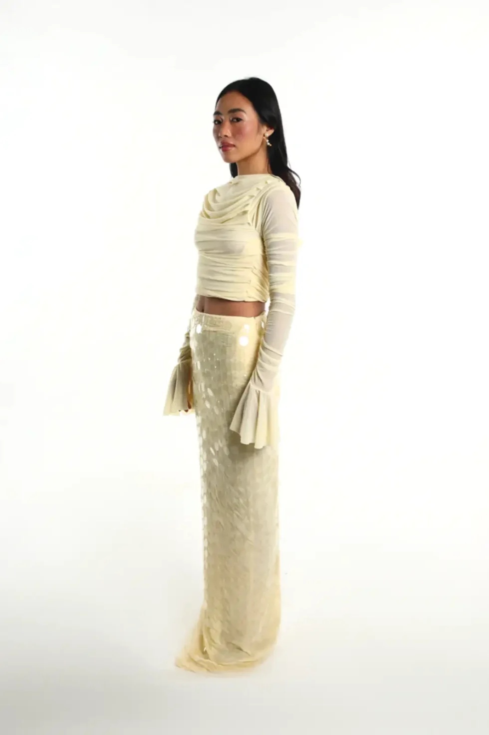 Ondina Yellow Lycra Net Top Skirt, Pastel Yellow Dress, Long Sleeve Top And Skirt Set, High Neck Dress For Women, Party Dress With Sleeves, Party Wear Long Skirts And Tops, Sepia Stories, Party Dress, Casual Long Skirts And Tops, Long Skirts And Tops For Ladies, High Neck Party Wear Dress For Women